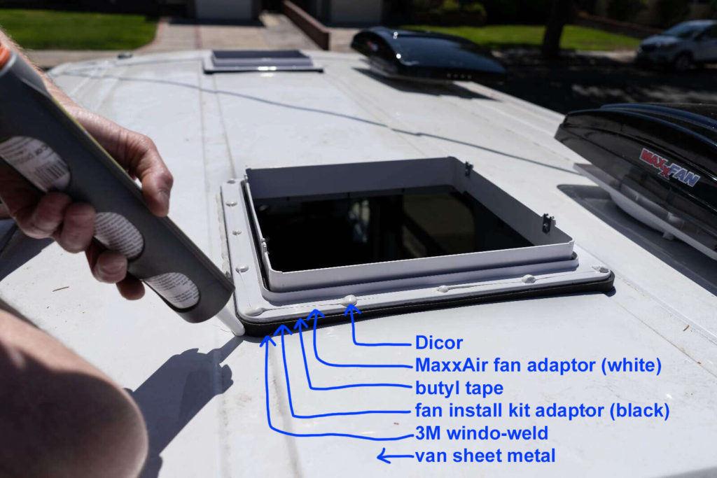 Installing MaxxFan fan on a camper van, showing layers: dicor, fan adapter, butyl tape, install kit adapter, 3M windo-weld