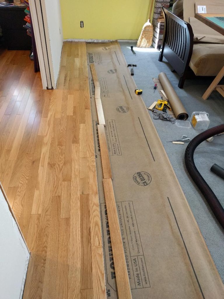 installing hardwood floor row ready
